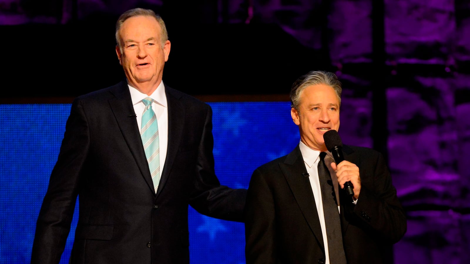 Bill O'Reilly and Jon Stewart onstage together in 2012.