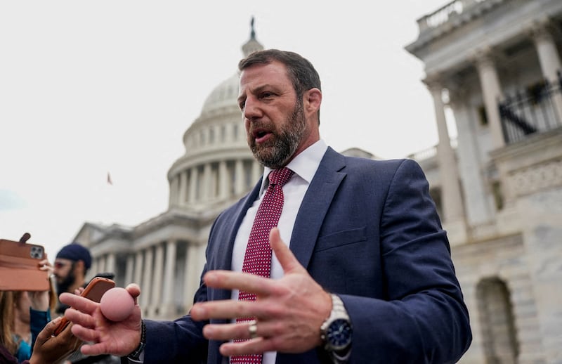U.S. Senator Markwayne Mullin (R-OK), tapped by U.S. President Donald Trump to replace U.S. Homeland Security Secretary Kristi Noem, holds a rubber ball while speaking to members of the media as he departs the U.S. Capitol after a vote in the U.S. Senate on funding for DHS, in Washington, D.C., U.S., March 5, 2026.