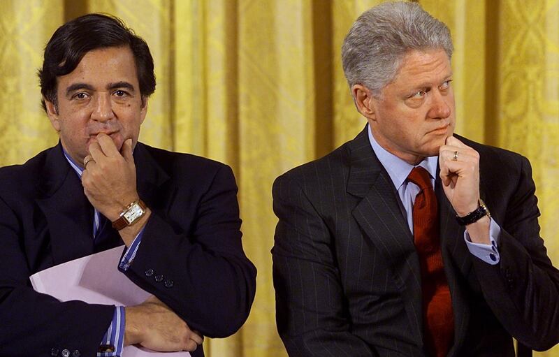 US President Bill Clinton (R) sits with Secretary of Energy Bill Richardson (L) in February 2000.