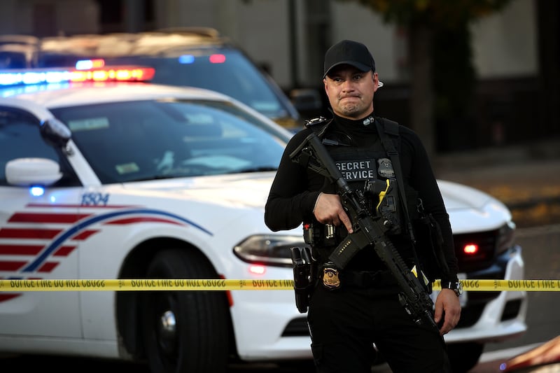 A member of the U.S. Secret Service secures the area near a shooting near the White House on Nov. 26, 2025 in Washington, DC. At least two uniformed military personnel, appearing to be National Guardsmen, have been shot blocks from the White House.