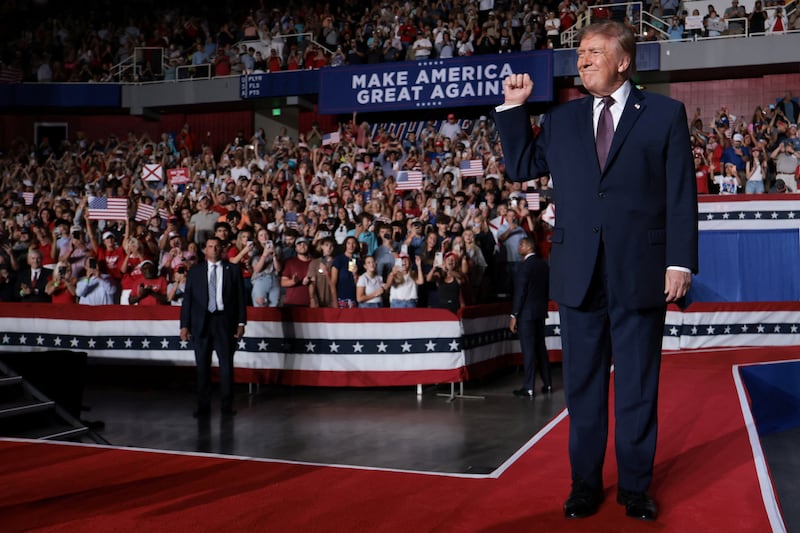US President Donald Trump raises his fist as he attends a rally, ahead of the midterm elections, at The Mitchell Center at the University of South Alabama in Mobile, Alabama, US, October 2, 2026. REUTERS/Jessica Koscielniak