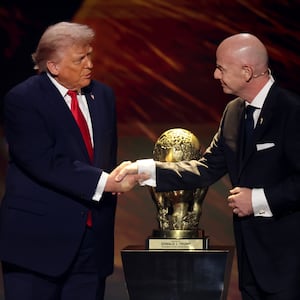 FIFA President Gianni Infantino shakes hands with President Donald Trump as he receives the inaugural FIFA Peace Prize during the FIFA World Cup 2026 Official Draw at John F. Kennedy Center for the Performing Arts on December 05, 2025.