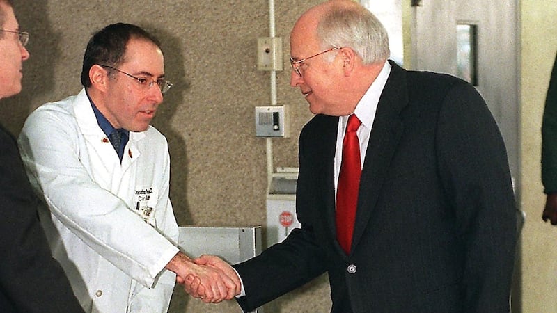US Vice President Dick Cheney (R) shakes hands with Dr. Jonathan Reiner (C) as he leaves the George Washington University Hospital 06 March 2001.