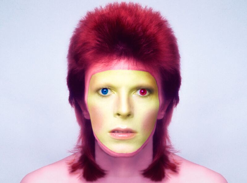 galleries/2013/01/09/david-bowie-s-eclectic-fashion-over-the-years-photos/david-bowie-tease_ryas9j