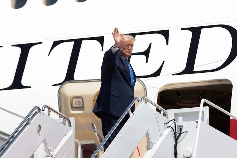 U.S. President Donald Trump waves as he boards Air Force One for travel to Los Angeles, at Joint Base Andrews in Maryland, U.S., August 4, 2026.