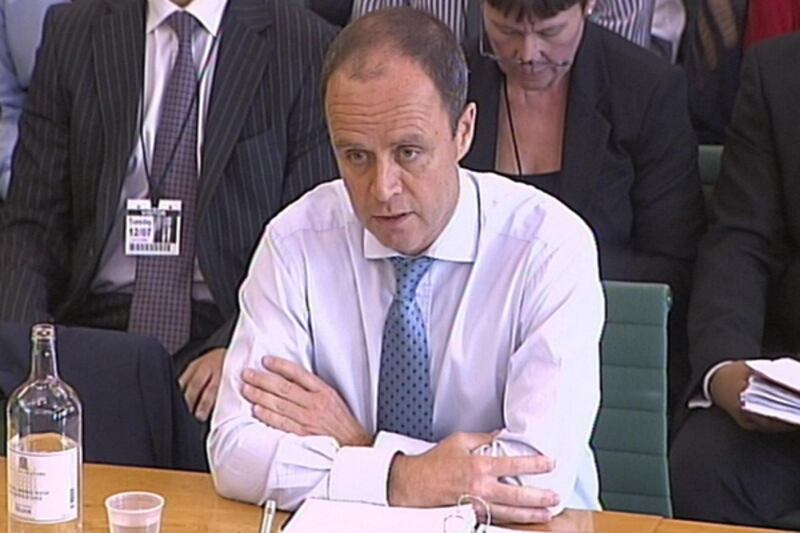 articles/2011/07/12/news-of-the-world-hacking-scandal-british-police-questioned/john-yates-hacking-giglio_bcjk3i