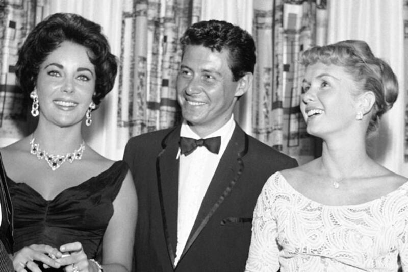 galleries/2012/11/12/when-the-mistress-meets-the-mrs-paula-broadwell-holly-petraeus-more-photos/liz-taylor-mrs-meets-mistress_kzaiyf