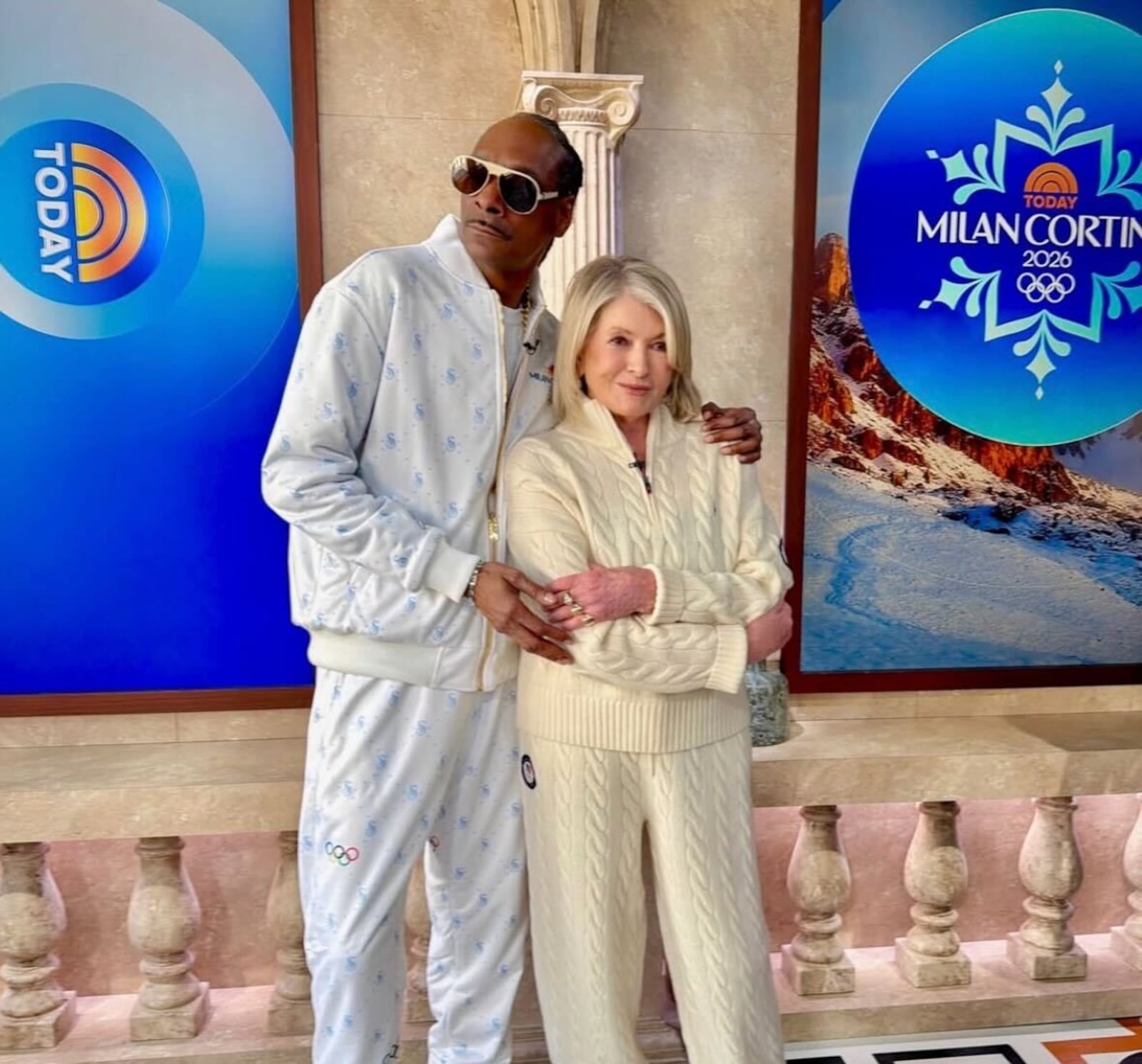 Snoop Dogg and Martha Stewart in coordinating tracksuits at the 2026 Winter Olympics in Italy.