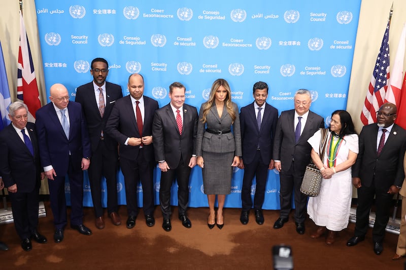 U.S. Ambassador to the United Nations Mike Waltz and First Lady Melania Trump pose for photos with ambassadors from other nations before a meeting of the United Nations Security Council at UN Headquarters in New York on March 2, 2026.