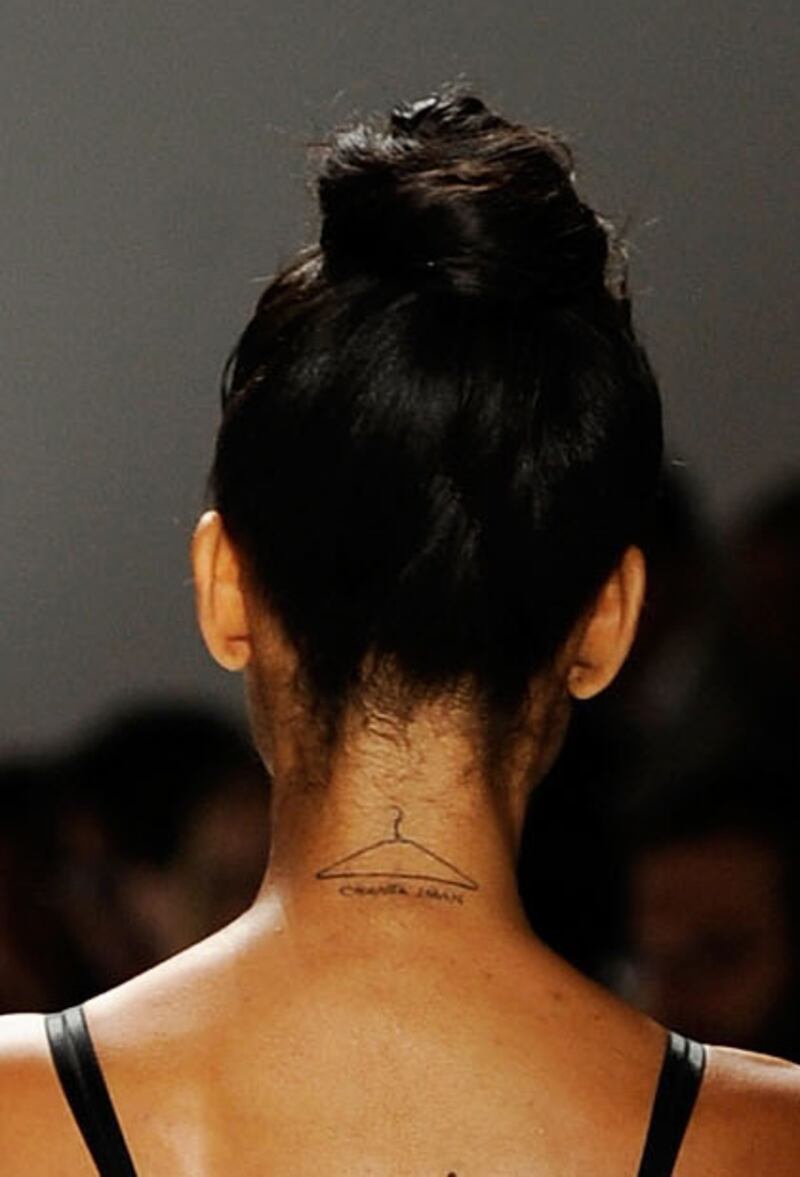 galleries/2012/09/05/kate-moss-to-gisele-bundchen-tattoos-guess-the-model-s-tattoos-photos/model-tattoos-iman-close_d7a8wo