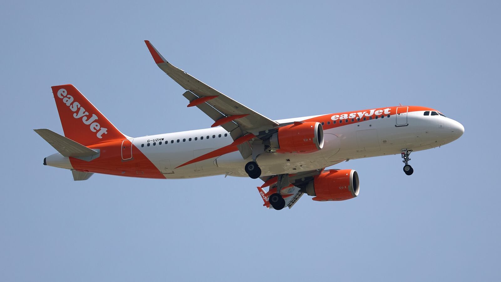 An easyJet Airbus A320-251N G-UZHW aircraft flies over the match venue during the UEFA European Under-17 Championship 2025, Round 2, League B, Group B5 qualifying soccer match between Luxembourg and Malta at the Centenary Stadium in Ta' Qali, Malta, on April 13, 2025. (Photo by Domenic Aquilina)