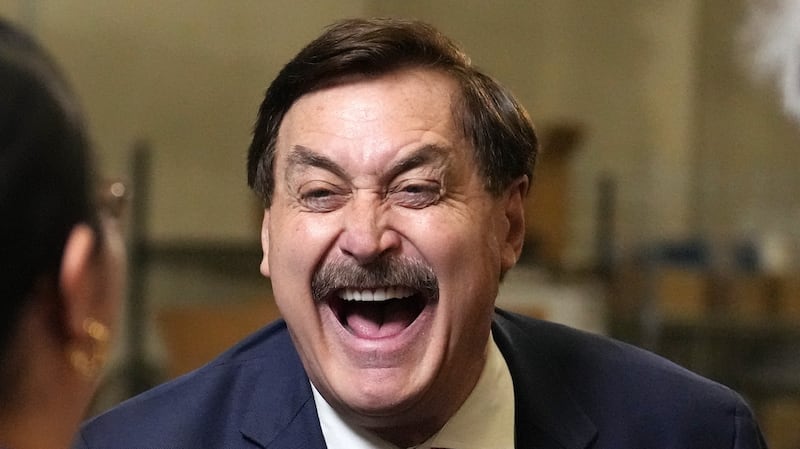 My Pillow founder and CEO Mike Lindell laughs as he greets reporters while announcing his run for Governor of Minnesota to a camera streaming to LindellTV Thursday, Dec. 11, 2025 at his company's warehouse in Shakopee, Minn.  ] ANTHONY SOUFFLE • anthony.souffle@startribune.com
