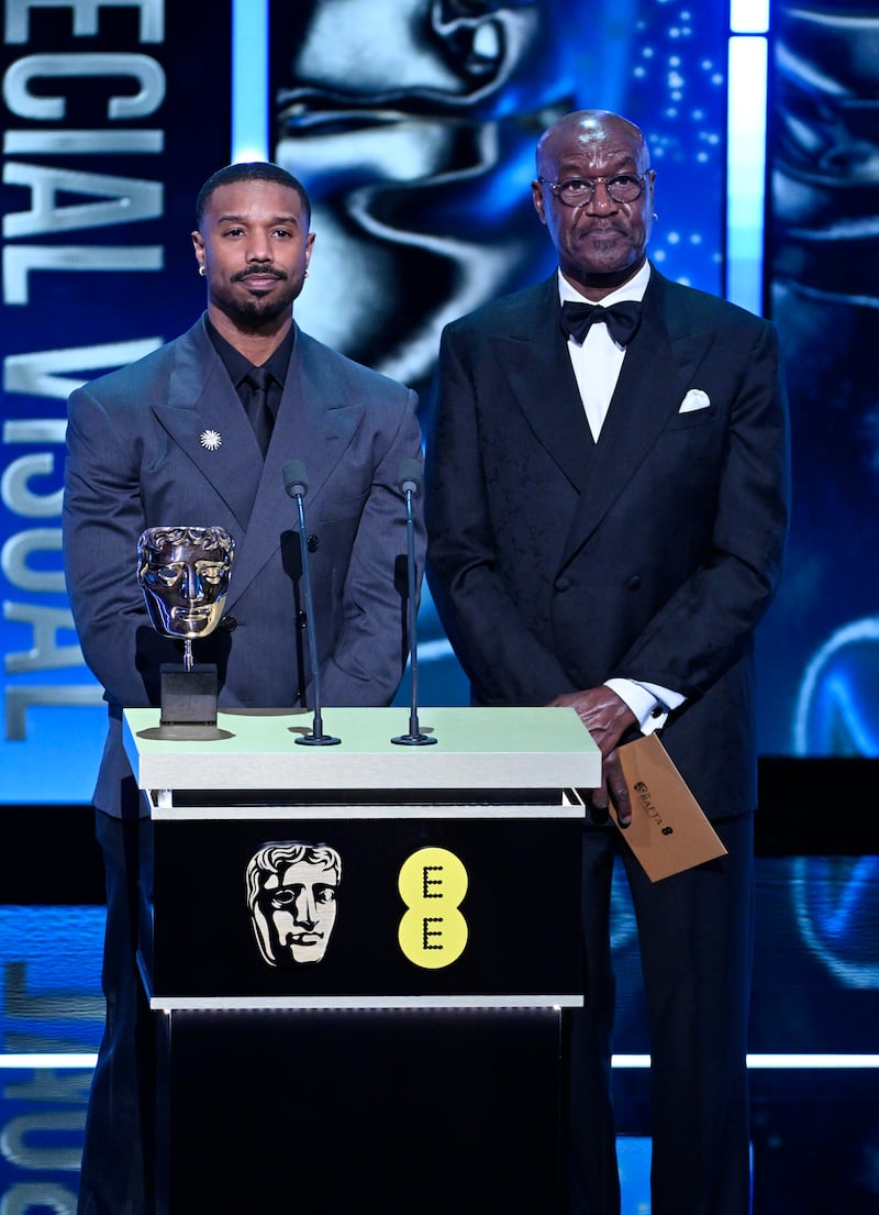 Michael B. Jordan and Delroy Lindo present the Special Visual Effects Award on stage during the EE BAFTA Film Awards 2026 at The Royal Festival Hall on February 22, 2026 in London, England.