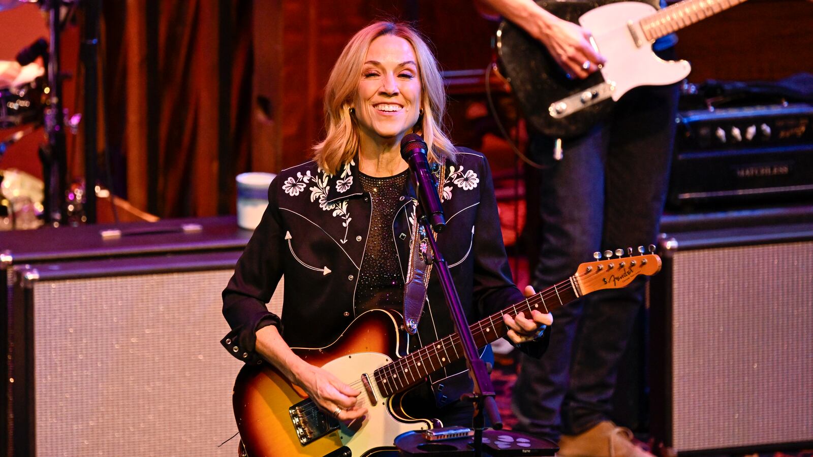 Sheryl Crow plays guitar during a performance at the Umbrella Arts Center in Massachusetts on Feb. 7.