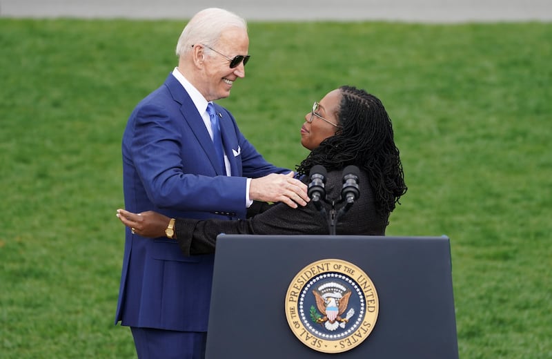 U.S. President Joe Biden embraces Judge Ketanji Brown Jackson during a celebration of her confirmation as the first Black woman to serve on the U.S. Supreme Court, on the South Lawn at the White House in Washington, U.S., April 8, 2022. REUTERS/Kevin Lamarque
