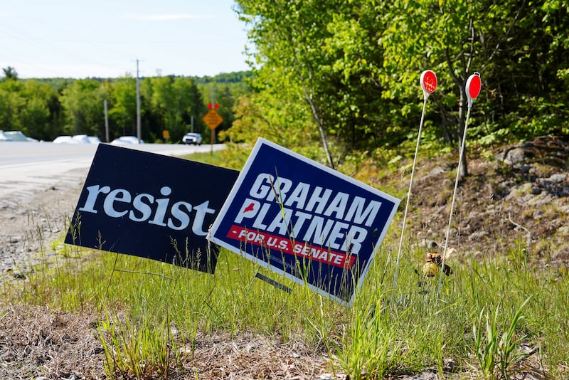 Election signs for Democratic Senate candidate Graham Platner stand outside a home in rural Maine near the town of Dedham on June 3, 2026.