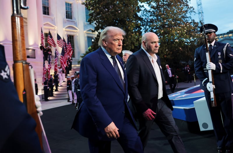 U.S. President Donald Trump and UFC CEO Dana White arrive for UFC Freedom 250 on the South Lawn of the White House in Washington, D.C., U.S., June 14, 2026. REUTERS/Jonathan Ernst