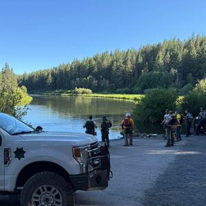 An emergency response vehicle on the banks of the Deschutes River.