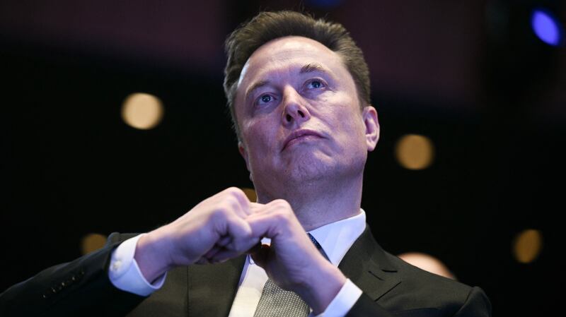 Elon Musk looks on as US President Donald Trump speaks at the US-Saudi Investment Forum at the John F. Kennedy Center for the Performing Arts in Washington, DC on November 19, 2025. (Photo by Brendan SMIALOWSKI / AFP) (Photo by BRENDAN SMIALOWSKI/AFP via Getty Images)