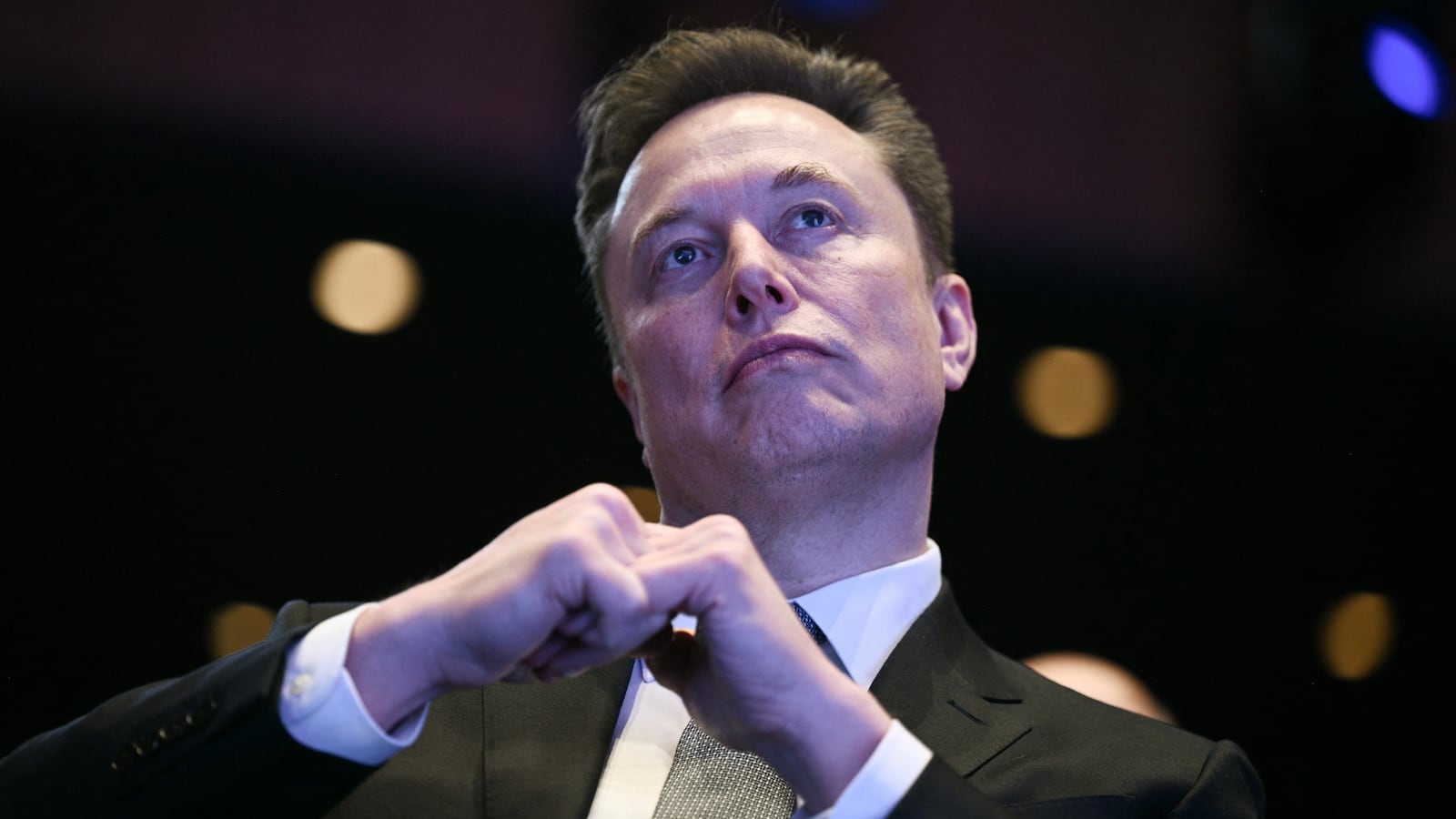 Elon Musk looks on as US President Donald Trump speaks at the US-Saudi Investment Forum at the John F. Kennedy Center for the Performing Arts in Washington, DC on November 19, 2025. (Photo by Brendan SMIALOWSKI / AFP) (Photo by BRENDAN SMIALOWSKI/AFP via Getty Images)