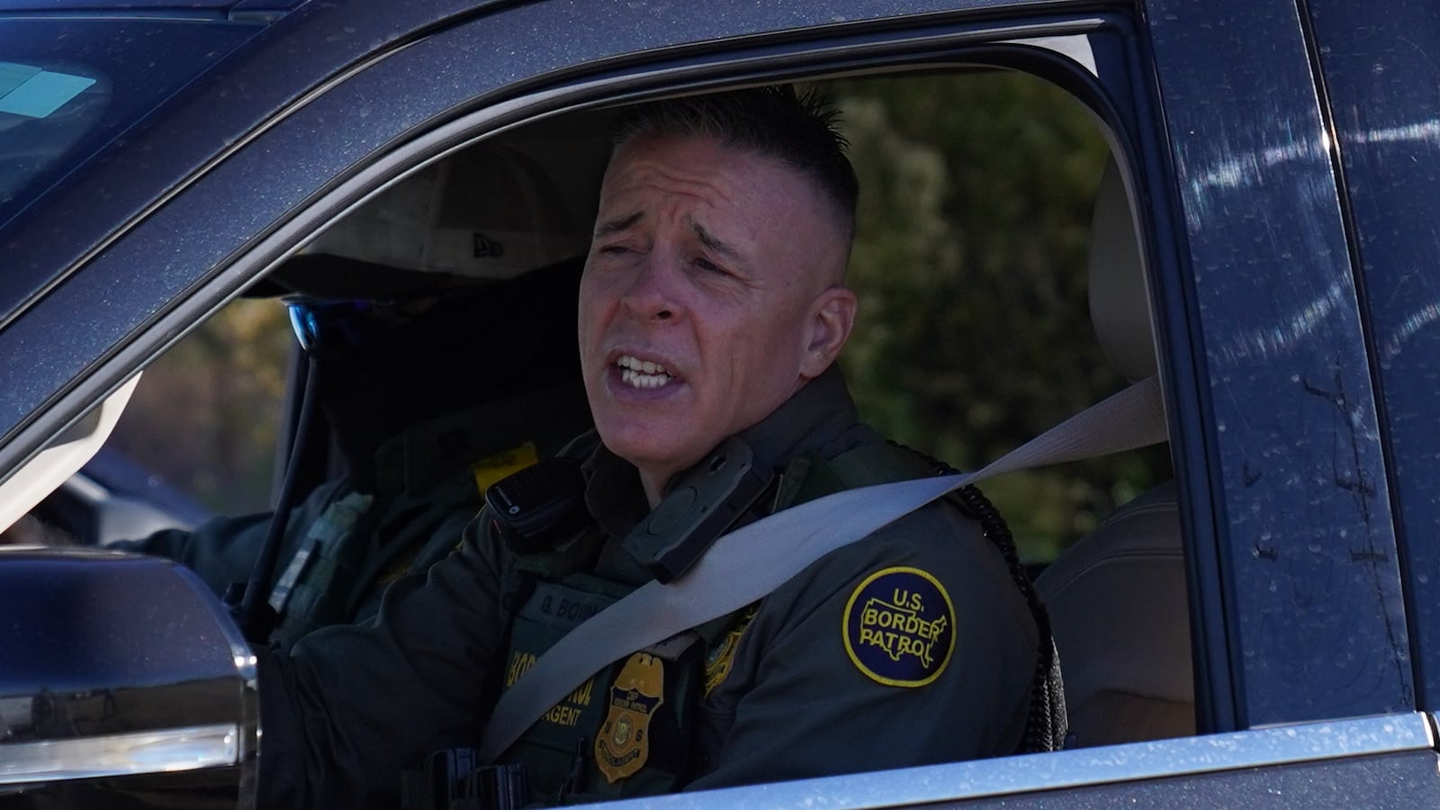 Border Patrol chief Greg Bovino drives a car of federal agents while searching for undocumented immigrants on November 17, 2025 in Charlotte, North Carolina. Federal agents are carrying out "Operation Charlotte's Web," an ongoing immigration enforcement surge across the Charlotte region.