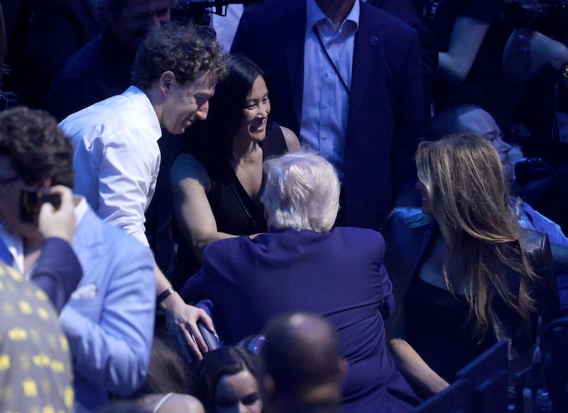 WASHINGTON, DC - JUNE 14: Meta Founder and CEO Mark Zuckerberg and Andrea Besmehn, VP of executive operations at Meta greet U.S. President Donald Trump and First Lady Melania Trump during the UFC Freedom 250 fights on the South Lawn of the White House on June 14, 2026 in Washington, DC. President Trump is hosting a series of Ultimate Fighting Championship matches on his 80th birthday, which the White House is calling "a once-in-a-generation celebration of the American fighting spirit.” (Photo by Chip Somodevilla/Getty Images)
