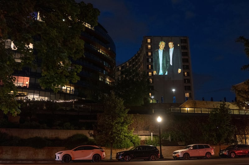 A photo of late financier and convicted sex offender Jeffrey Epstein and U.S. President Donald Trump is projected onto the Washington Hilton in Washington, D.C., U.S., April 24, 2026. REUTERS/Aaron Schwartz
