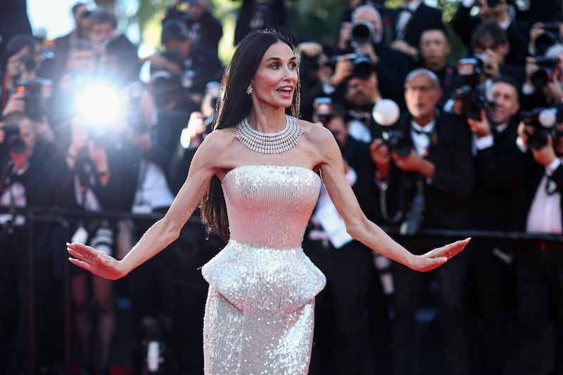 Jury member Demi Moore poses on the red carpet during arrivals for the opening ceremony and the screening of the film "La Venus electrique" (The Electric Kiss) Out of competition, at the 79th Cannes Film Festival