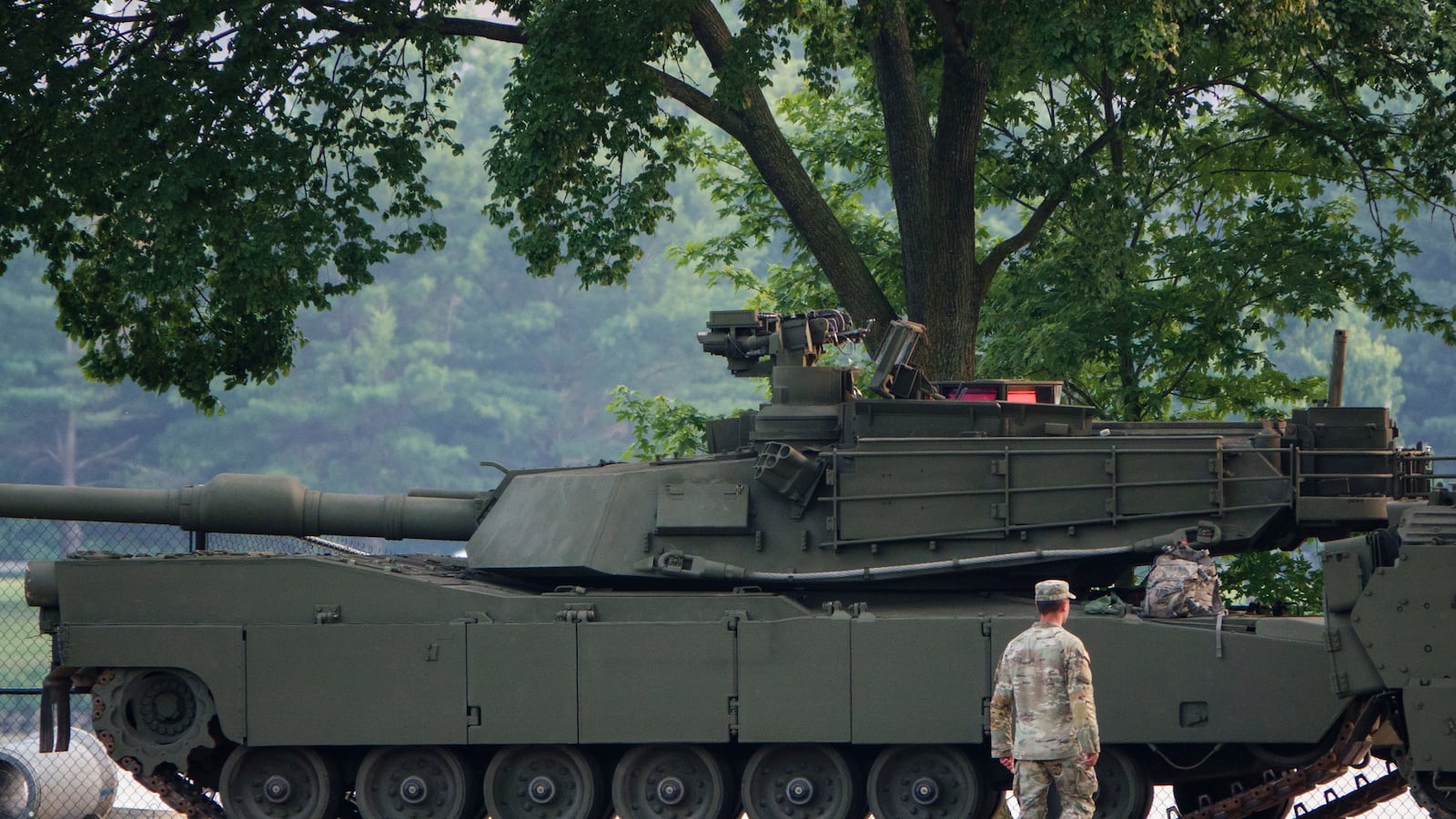 An Army soldier walks near a tank at West Potomac Park in preparation for the Army's 250th Anniversary Parade on June 12, 2025 in Washington, DC, but many Republican lawmakers are not sticking around for the festivities taking place on President Trump's birthday.