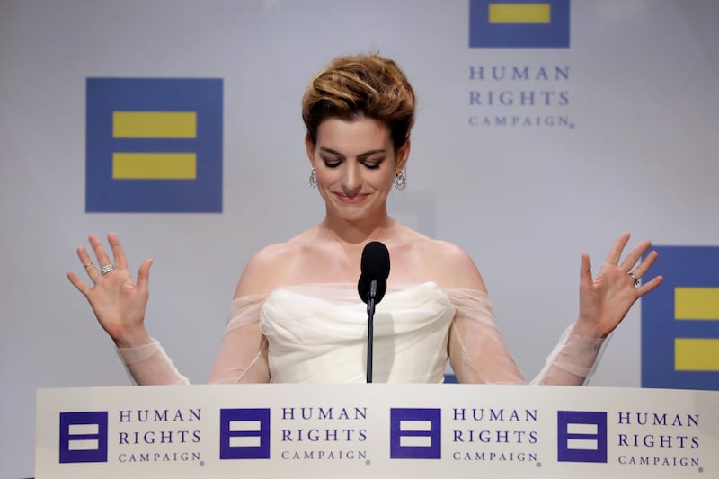 Actor Anne Hathaway reacts as she speaks after receiving an award at the Human Rights Campaign (HRC) dinner in Washington, U.S., September 15, 2018.