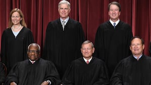 Justices of the US Supreme Court pose for their official photo at the Supreme Court in Washington, DC on October 7, 2022. (Seated from left) Associate Justice Sonia Sotomayor, Associate Justice Clarence Thomas, Chief Justice John Roberts, Associate Justice Samuel Alito and Associate Justice Elena Kagan, (Standing behind from left) Associate Justice Amy Coney Barrett, Associate Justice Neil Gorsuch, Associate Justice Brett Kavanaugh and Associate Justice Ketanji Brown Jackson. (Photo by OLIVIER DOULIERY / AFP) (Photo by OLIVIER DOULIERY/AFP via Getty Images)