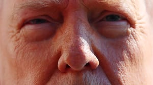 WASHINGTON, DC - FEBRUARY 13: U.S. President Donald Trump talks with reporters as he and first lady Melania Trump leave the White House on February 13, 2026 in Washington, DC. Trump is traveling to Fort Bragg in North Carolina to visit Special Operations troops who were involved in the capture of Venezuelan President Nicolas Maduro before continuing to his private Mar-a-Lago Club in Palm Beach, Florida, for the weekend. (Photo by Michael M. Santiago/Getty Images)