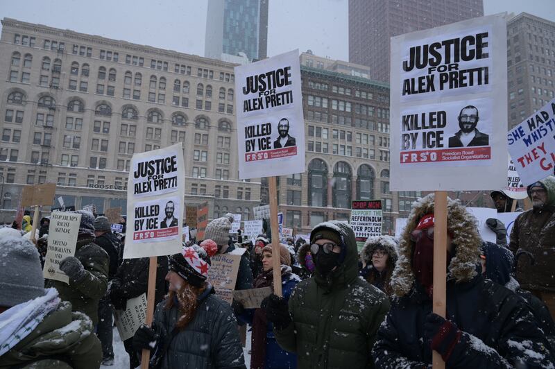 Demonstrators gather in a heavy snowstorm on Michigan Avenue to protest against U.S. Immigration and Customs Enforcement (ICE) and Customs and Border Protection (CBP) in Chicago, US on January 25, 2026.