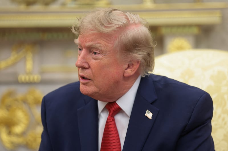 U.S. President Donald Trump speaks as he hosts 16-year-old lifeguard Ryder Williams, who saved a child off the coast of Santa Cruz, California, last month, Nathaniel Rai, the child saved by Williams, and Nathaniel's family members in the Oval Office at the White House in Washington, D.C., U.S., August 17, 2026.