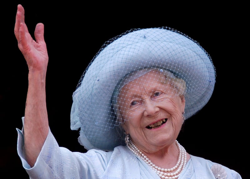 Queen Elizabeth, the Queen Mother, celebrates her 100th birthday from the balcony of Buckingham Palace August 4, 2000.
