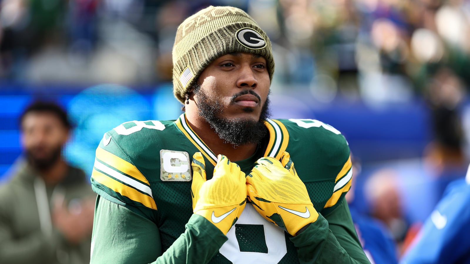 EAST RUTHERFORD, NEW JERSEY - NOVEMBER 16: Josh Jacobs #8 of the Green Bay Packers stands on the sidelines during the national anthem prior to an NFL football game against the New York Giants at MetLife Stadium on November 16, 2025 in East Rutherford, New Jersey. (Photo by Kevin Sabitus/Getty Images)