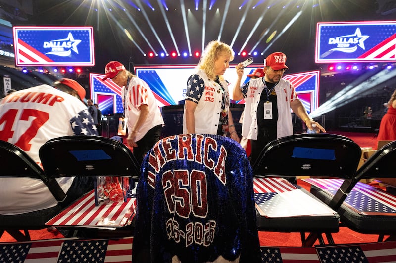 Front Row Joes, from left, John Russell, of Illinois, Karen Sergison, of Michigan, Karen Goldman, of Troy, Texas, and Binh Vo, of Florida, plan their seating assignments before the Republican convention at the American Airlines Center in Dallas, Wednesday, Sept. 9, 2026.