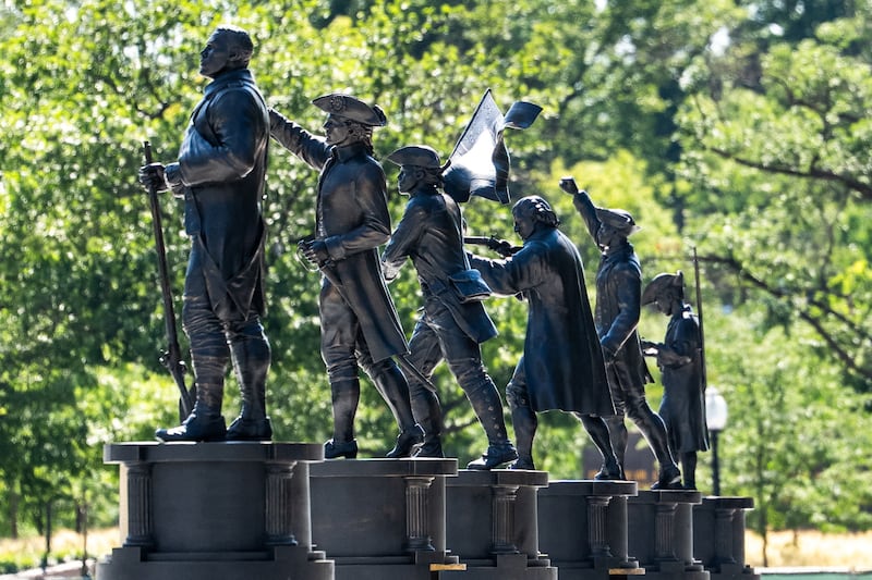 Statues stand inside the fenced-off Freedom Plaza during ongoing renovations in Washington, D.C., U.S., June 21, 2026.