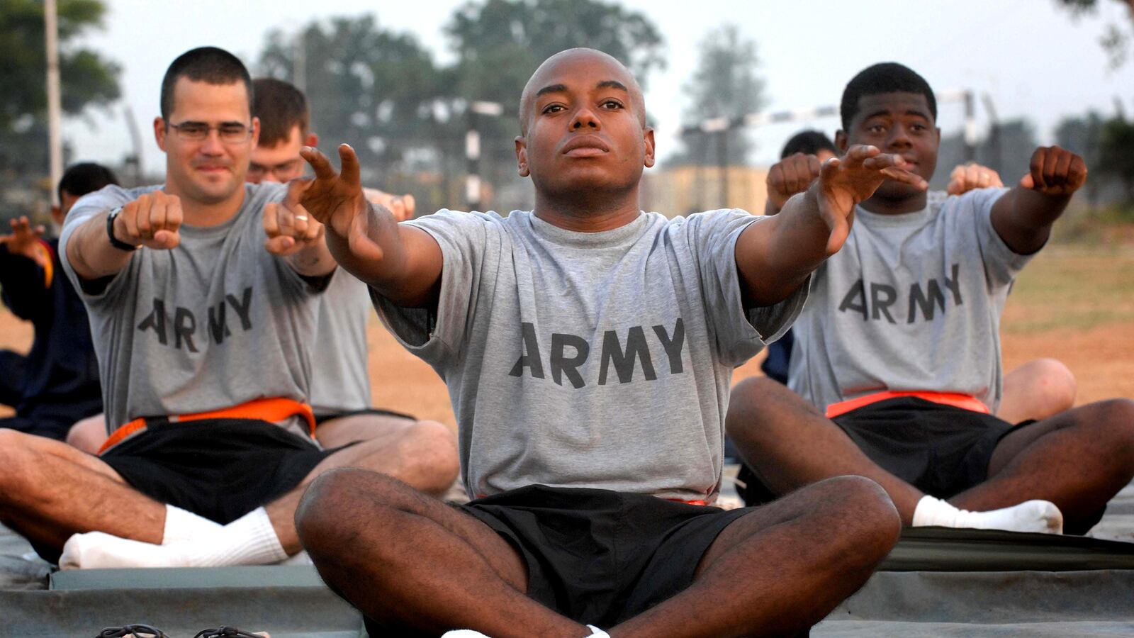 articles/2015/05/23/the-downward-facing-dogs-of-war/150522-adamic-yoga-tease_lcp3xi