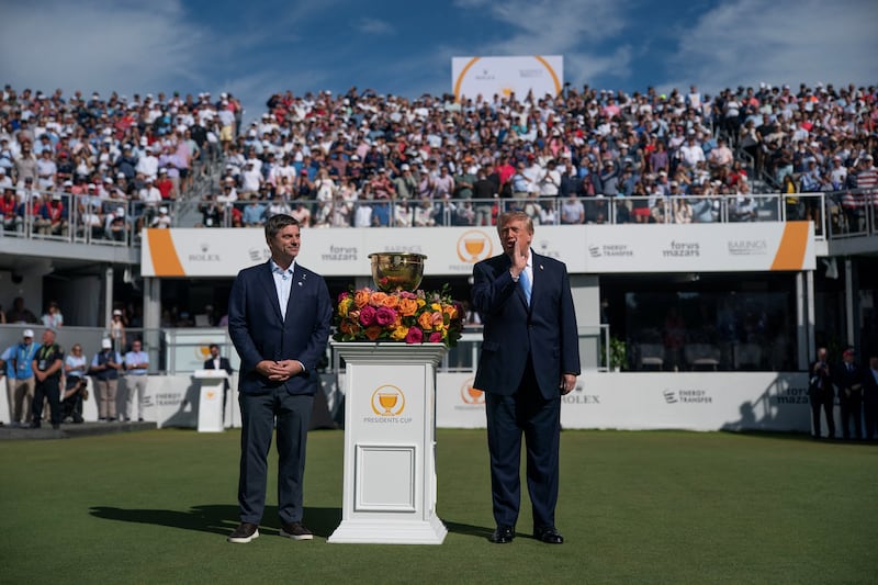 US President Donald Trump, next to the CEO of the PGA TOUR Brian Rolapp, speaks during the Presidents Cup at the Medinah Country Club in Medinah, Illinois, US, September 27, 2026. REUTERS/Nathan Howard