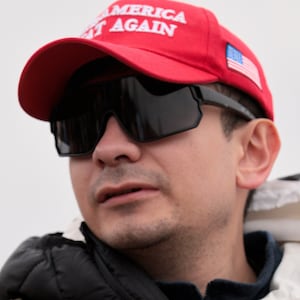 Bryan Betancur holds a Certificate of Pardon from President Donald Trump during a January 6th memorial march marking five years since the attack on January 06, 2026, in Washington, DC.