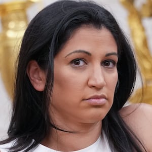 White House Deputy Chief of Staff Stephen Miller's wife, Katie Miller, listens as U.S. President Donald Trump and Tesla CEO Elon Musk speak to reporters in the Oval Office of the White House on May 30, 2025 in Washington, DC.