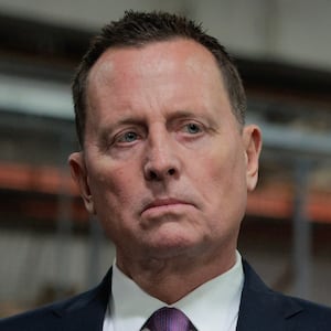 U.S. President Donald Trump speaks to the media alongside Richard Grenell.