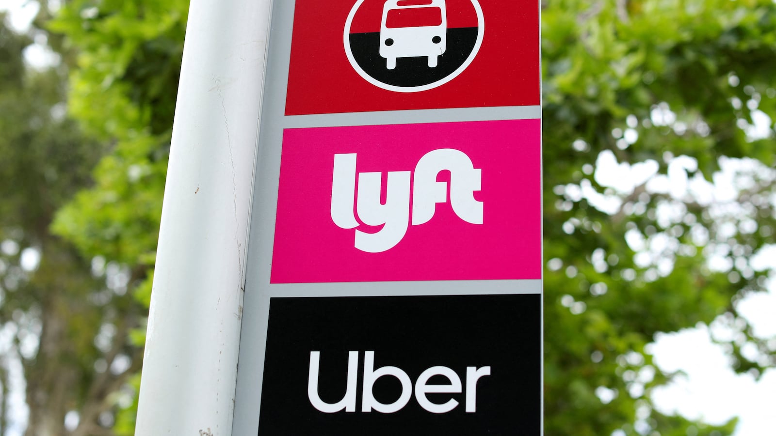 A sign marks a rendezvous location for Lyft and Uber users