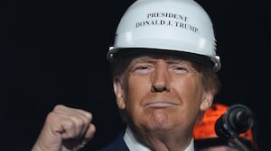 LATROBE, PENNSYLVANIA - OCTOBER 19: Republican presidential nominee, former U.S. President Donald Trump, wears a hard hat given to him by steelworker during a campaign rally on October 19, 2024, in Latrobe, Pennsylvania. There are 17 days remaining until the U.S. presidential election, which will take place on Tuesday, November 5, 2024. (Photo by Win McNamee/Getty Images)