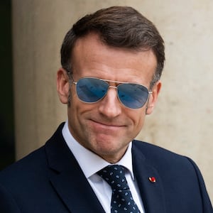 France s President Emmanuel Macron wearing a sunglasses waits to welcome Prime Ministers of Greenland and Denmark at the Elysee Palace in Paris, on January 28, 2026. (Photo by Magali Cohen / Hans Lucas / AFP via Getty Images)