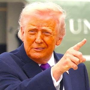 President Donald Trump gestures at Joint Base Andrews in Maryland, U.S., March 11, 2026.
