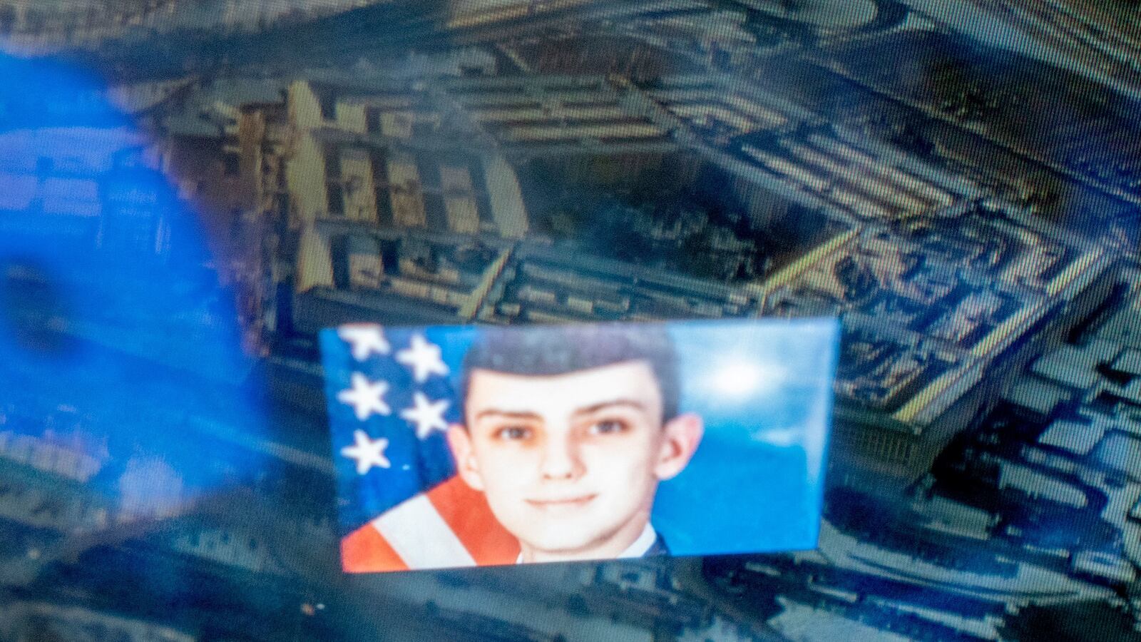 This photo illustration created on April 13, 2023, shows the Discord logo and the suspect, national guardsman Jack Teixeira, reflected in an image of the Pentagon in Washington, DC