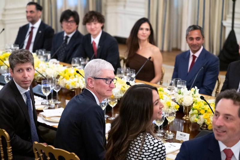 Tech leaders, including Sam Altman (L), CEO of OpenAI, and Tim Cook (2nd L), CEO of Apple, attend a dinner hosted by US President Donald Trump with tech leaders in the State Dining Room of the White House in Washington, DC, on September 4, 2025. (Photo by SAUL LOEB / AFP) (Photo by SAUL LOEB/AFP via Getty Images)