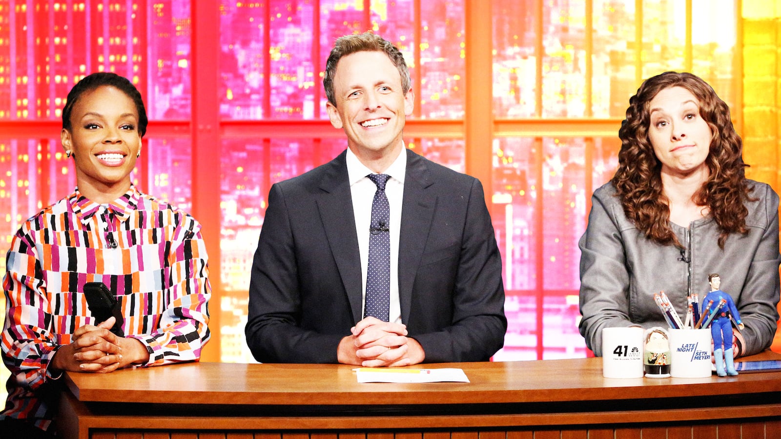 A photo illustration of Amber Ruffin, host Seth Meyers and Jenny Hagel during 'Jokes Seth Can't Tell' sketch.